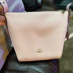Coach light pink leather bucket crossbody.